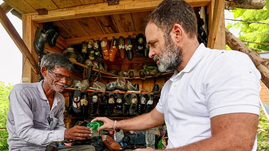 <div class="paragraphs"><p>Leader of Opposition in Lok Sabha Rahul Gandhi interacts with a cobbler during his visit to Sultanpur, Uttar Pradesh.</p></div>